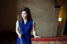 Load image into Gallery viewer, Phoebe Robertson, flute soloist, holding a flute in a staircase.
